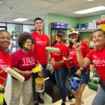 Sugarloaf Keller Williams agents helping paint at Streetwise on Red Day 2022